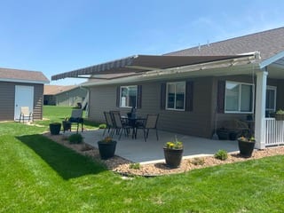 Minnesota Awnings retractable awning installed over a patio